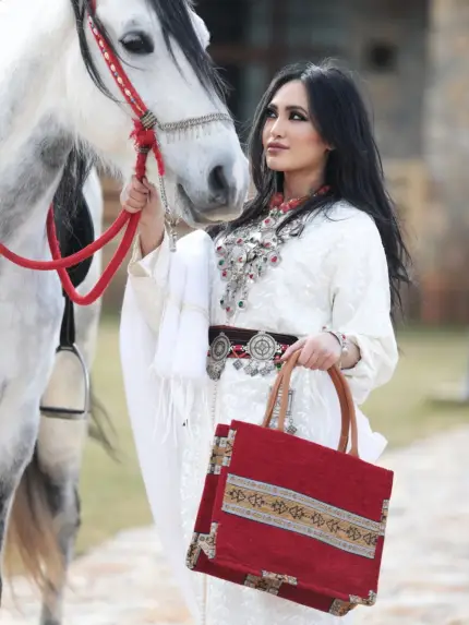 Berber pattern handbag with intricate colorful shapes ,featuring sturdy top handles and a black suede interior